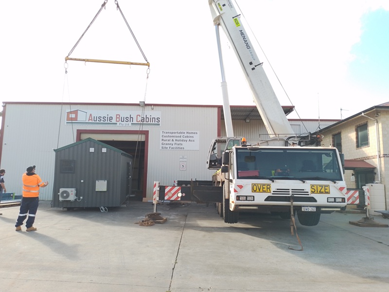 loading a house onto truck at warehouse
